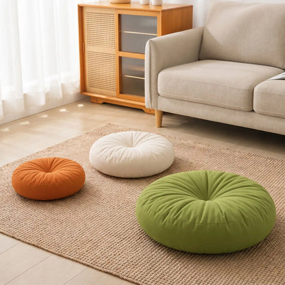coussin de sol rond orange blanc et vert de tailles différentes